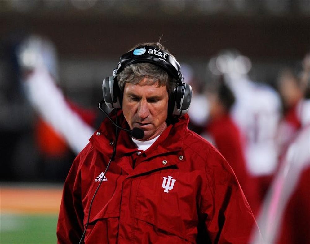 IU head coach Bill Lynch looks to the scoreboard during Saturday night's Big Ten conference road game at the University of Illinois. The Hoosiers lost to the Illini 55-13.