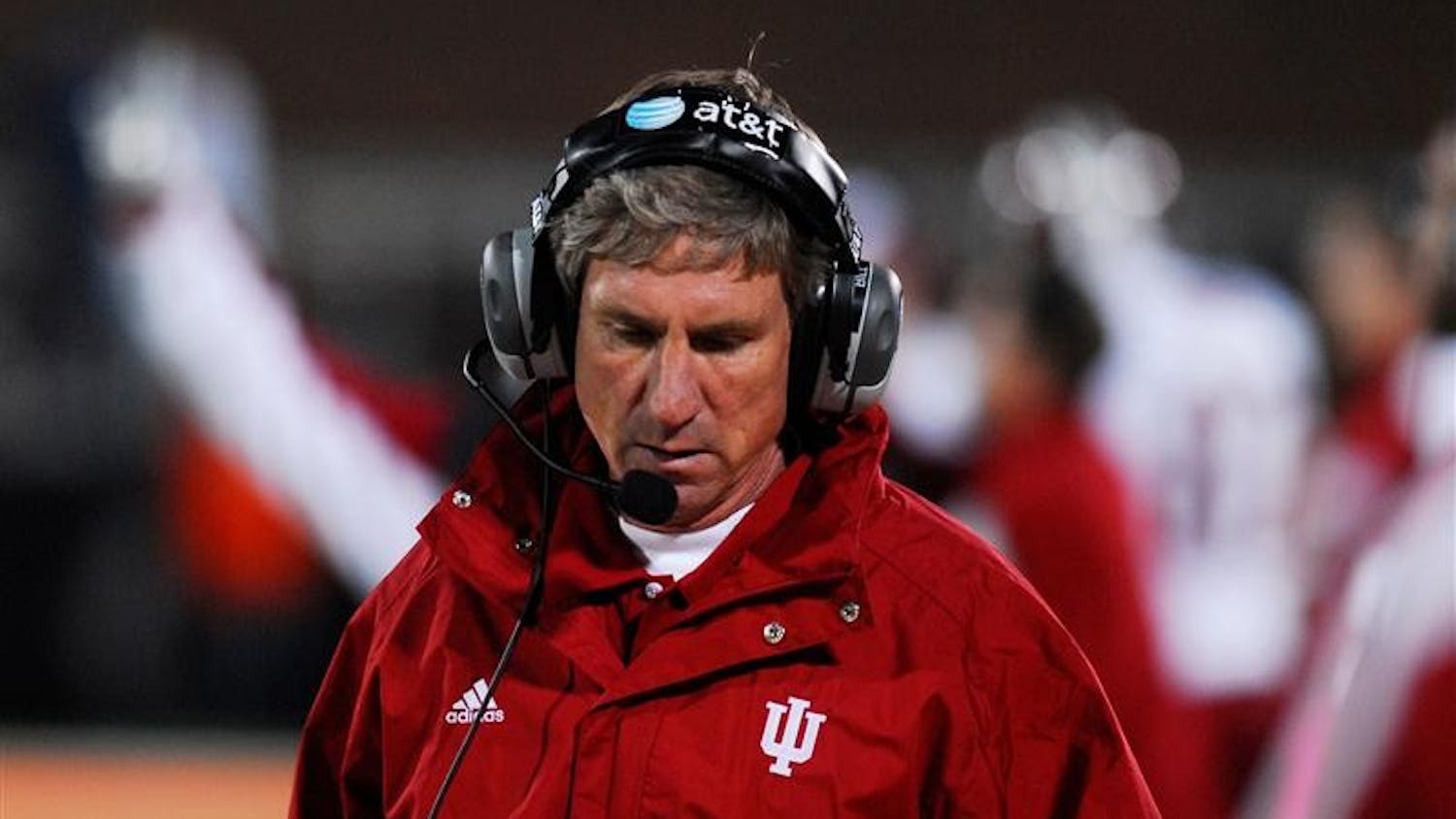 IU head coach Bill Lynch looks to the scoreboard during Saturday night's Big Ten conference road game at the University of Illinois. The Hoosiers lost to the Illini 55-13.