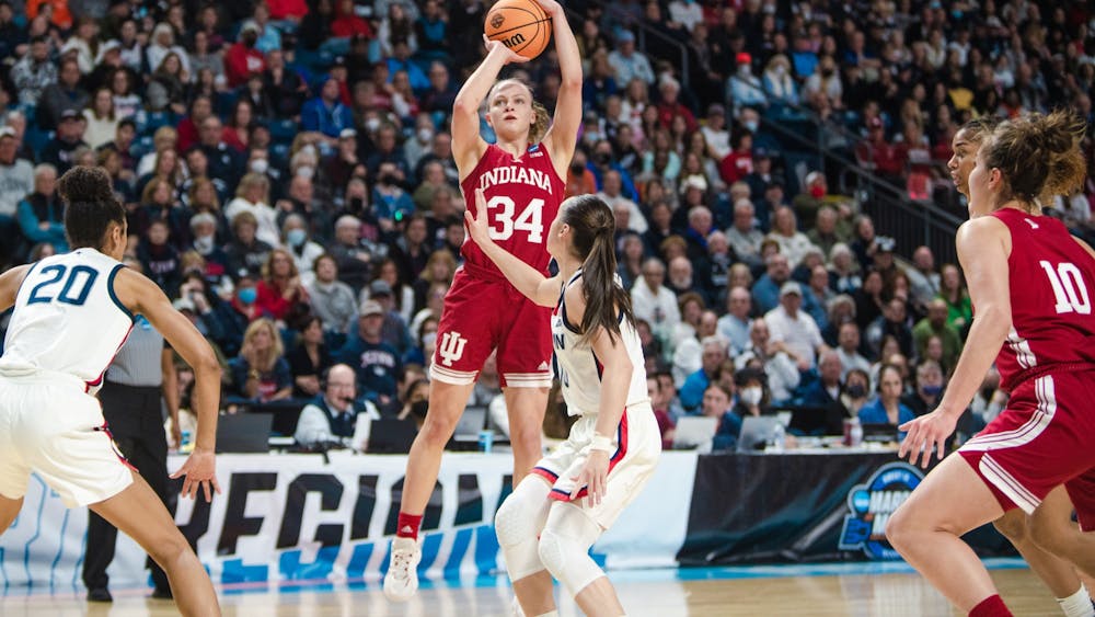 Senior guard Grace Berger shoots a three Mar. 26, 2022, at Total Mortgage Arena in Bridgeport, CT. Indiana lost 75-58 against UConn. Berger will be vital to Indiana women&#x27;s basketball&#x27;s success in the 2022-23 season.