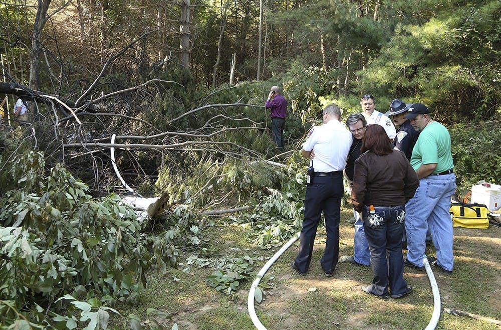 Federal Aviation Administration, fire and police responders investigate the scene of a plane crash near Monroe County Airport on Thursday afternoon.