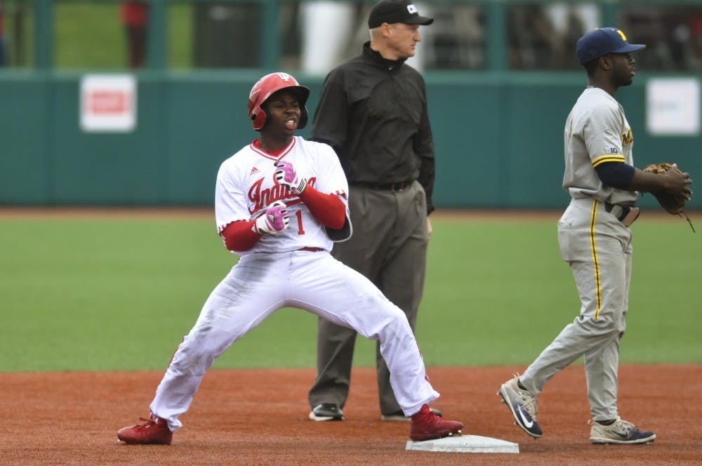 Jeremy Houston celebrates a leadoff double in the eighth inning against Michigan. IU survived a 13-inning battle against Michigan to advance in the Big Ten tournament.