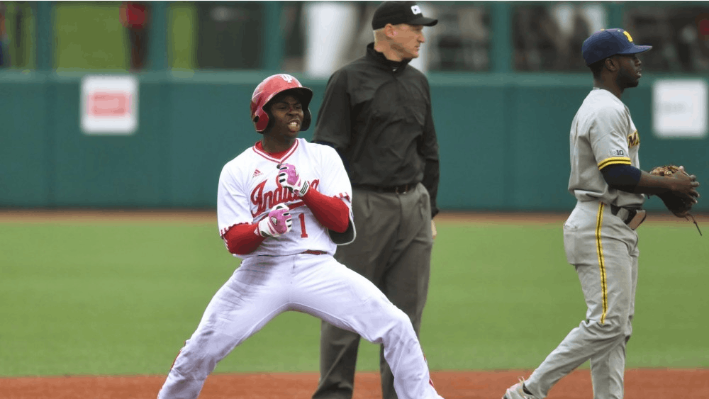 Jeremy Houston celebrates a leadoff double in the eighth inning against Michigan. IU survived a 13-inning battle against Michigan to advance in the Big Ten tournament.