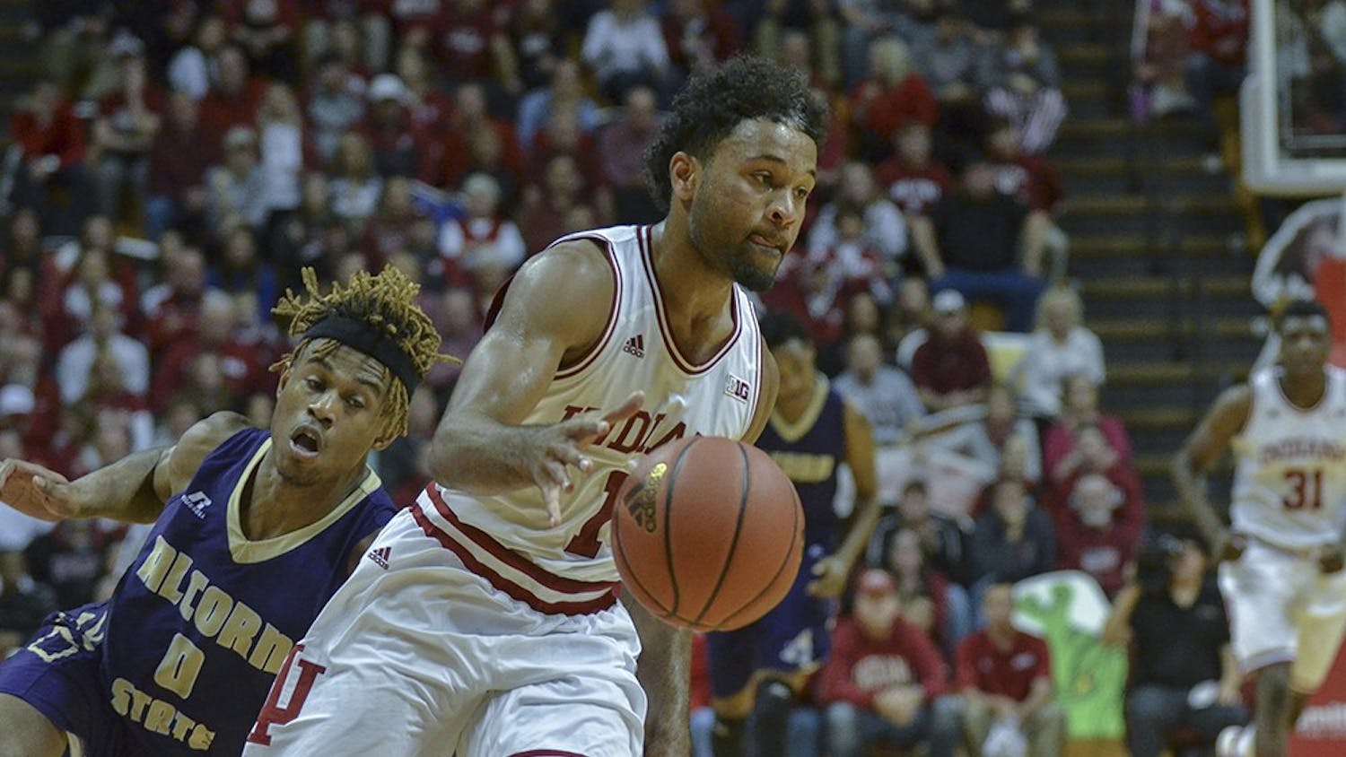 Sophomore guard James Blackmon Jr. trips up his Alcorn State defender as he drives for layup Monday at Assembly Hall. The Hoosiers won 112-70.