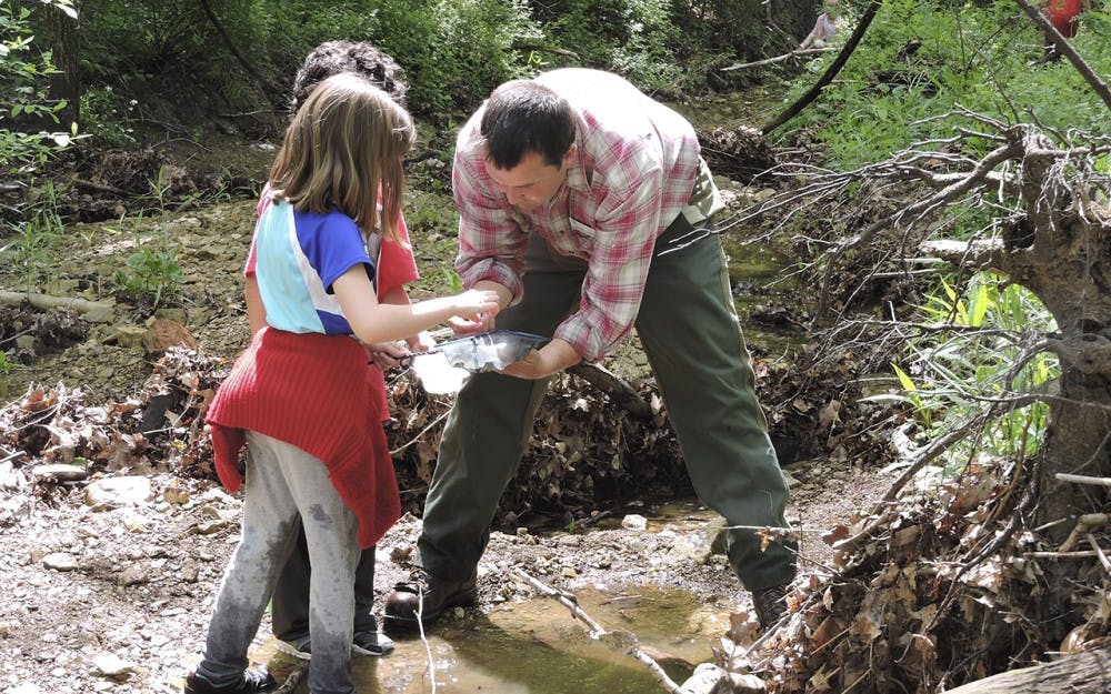 Gibson brings kids from the classroom into nature and encourages them to look and learn from what they find outside to make them more involved with nature.