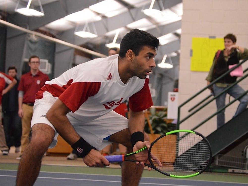 Then-junior, now-senior, Raheel Manji waits for a Louisville serve during a match Wednesday, Feb. 8, 2017, in the IU Tennis Center. IU went 1-1 this weekend to conclude its regular season.