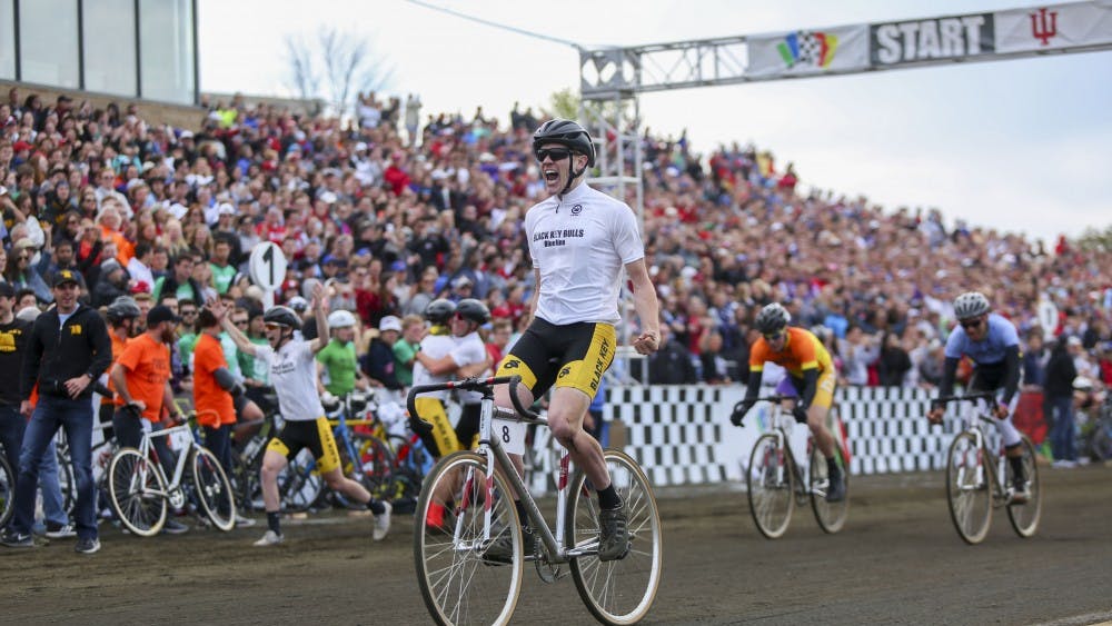 Junior Kevin Mangel crosses the finish line of the Men's 2017 Little 500 Bike Race.  The Black Key Bulls clinched their second Little 500 title at the Bill Armstrong Stadium Saturday.  