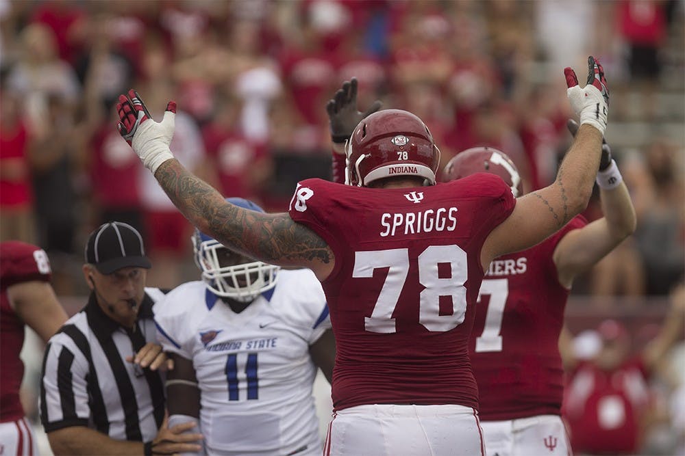 Senior offensive lineman Jason Spriggs celebrates a touchdown during IU's game against Indiana State on Aug. 30, 2014, at Memorial Stadium.