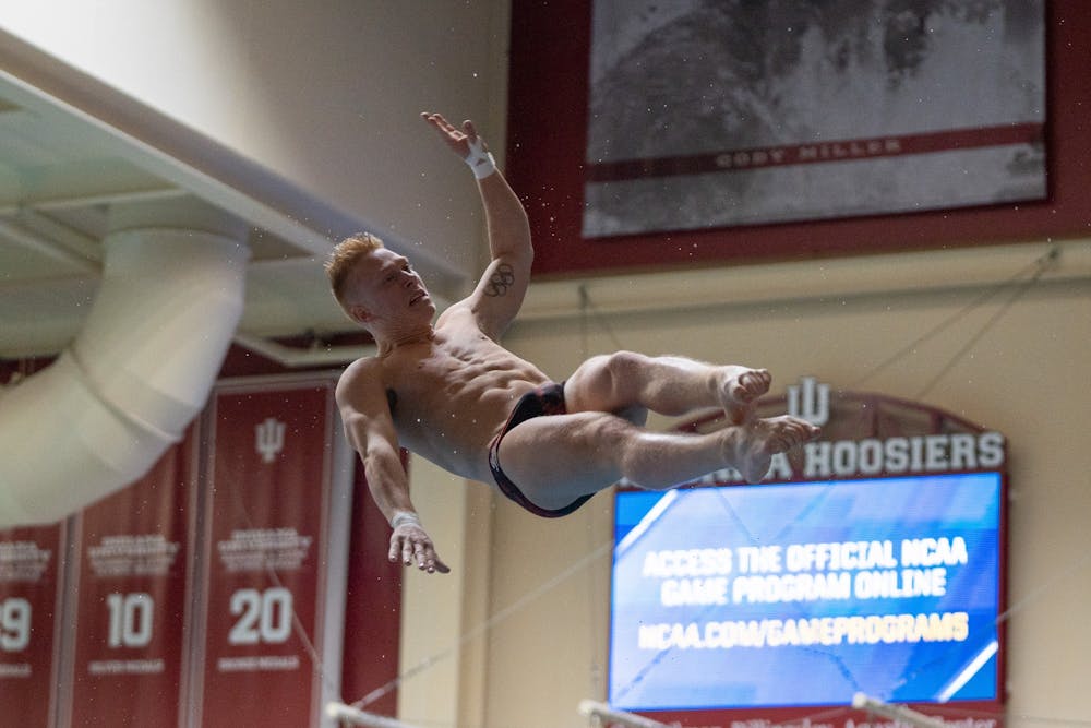 <p>Graduate diver Andrew Capobianco twists in the air during a dive on March 9, 2023, during the NCAA Zone C men&#x27;s diving championship at the Councilman-Billingsley Aquatics Center. IU dominated the podium with Capobianco, Quentin Henninger and Carson Tyler taking first, second and third places respectively.</p>