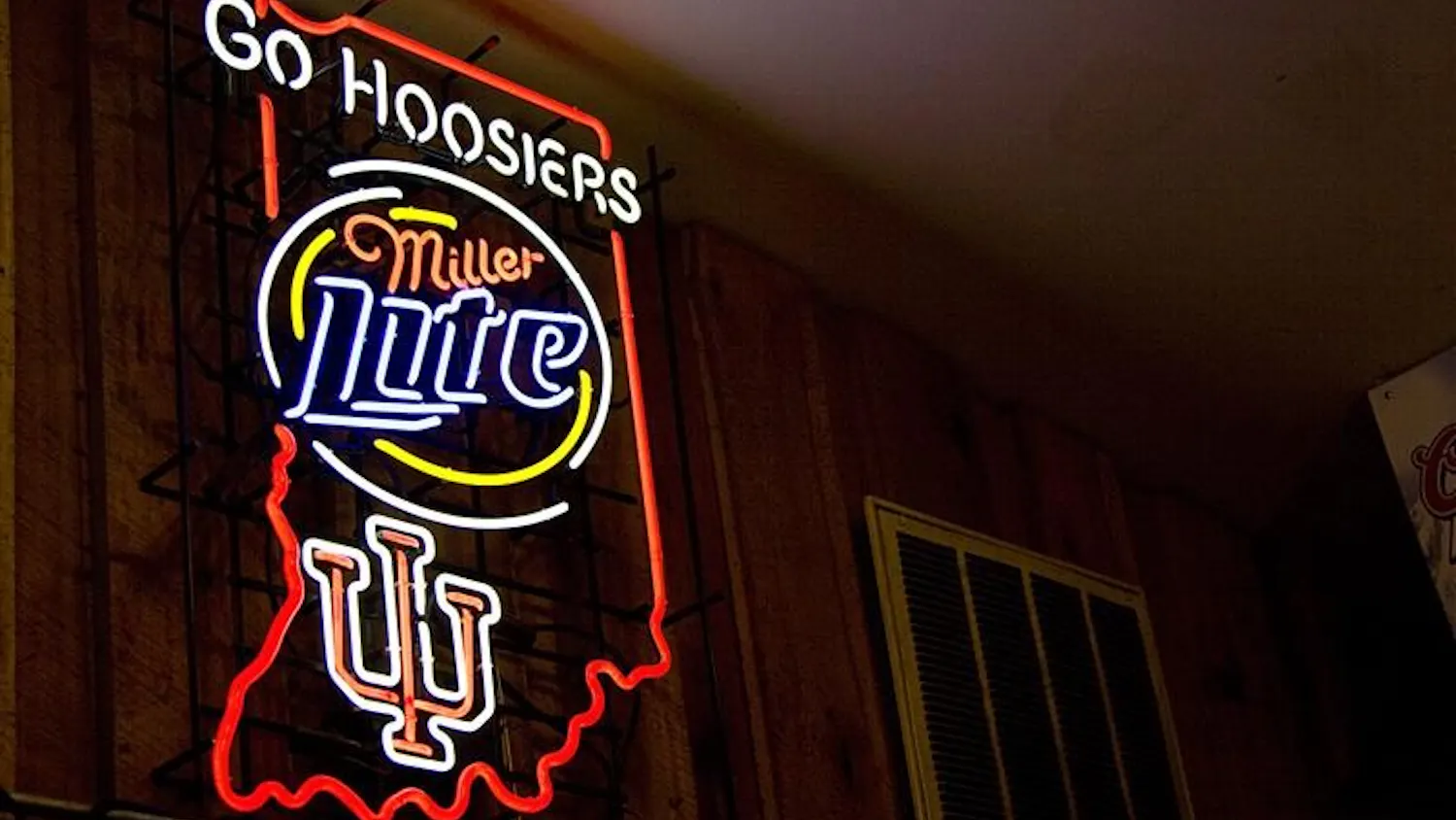 This sign displayed outside of Nick's English Hut, has caused controversy because IU's logo is represented next to an alcoholic company