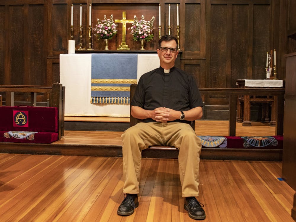 The Rev. Matt Seddon sits on a chair April 19, 2021, in the Trinity Episcopal Church in Bloomington. Trinity is a LGBTQ-welcoming church, according to its website.