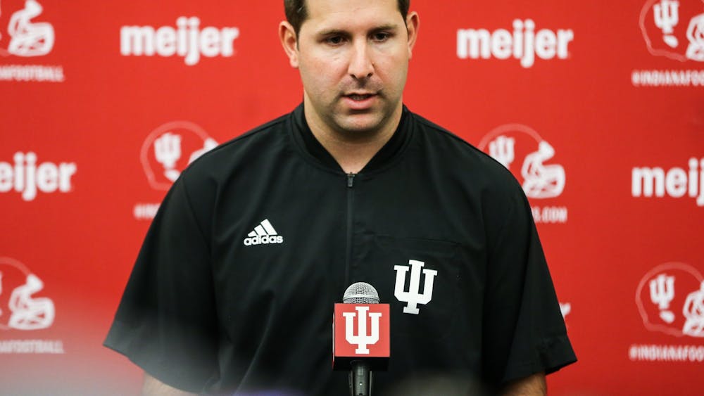 IU football offensive coordinator and quarterbacks coach Nick Sheridan speaks during Media Day on Thursday in Bloomington. Sheridan said the team will be able to see what graduate student running back Stephen Carr can do on the field in the next two weeks.