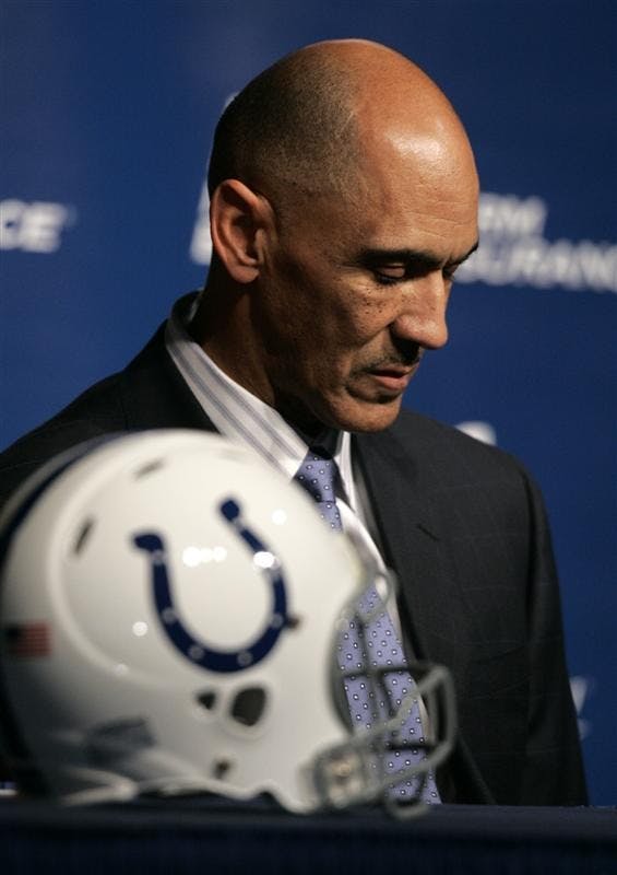 Indianapolis Colts coach Tony Dungy listens as team owner Jimmy Irsay announces that Dungy will retire in Indianapolis, Monday. Dungy has been a head football coach in the NFL for 13 years, seven with the Colts. He will be replaced by Jim Caldwell. 