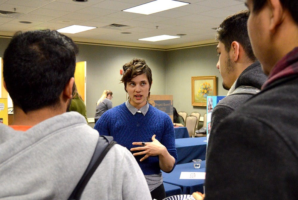 Jen Burch, center, crisis intervenction services coordinator at Middle Way House, informs students about human trafficking Tuesday at State Room East in the Indiana Memorial Union. "The Hidden Reality: An Interactive Program on Human Trafficking" included an interactive process that led participants through various countries where human trafficking occurs. 