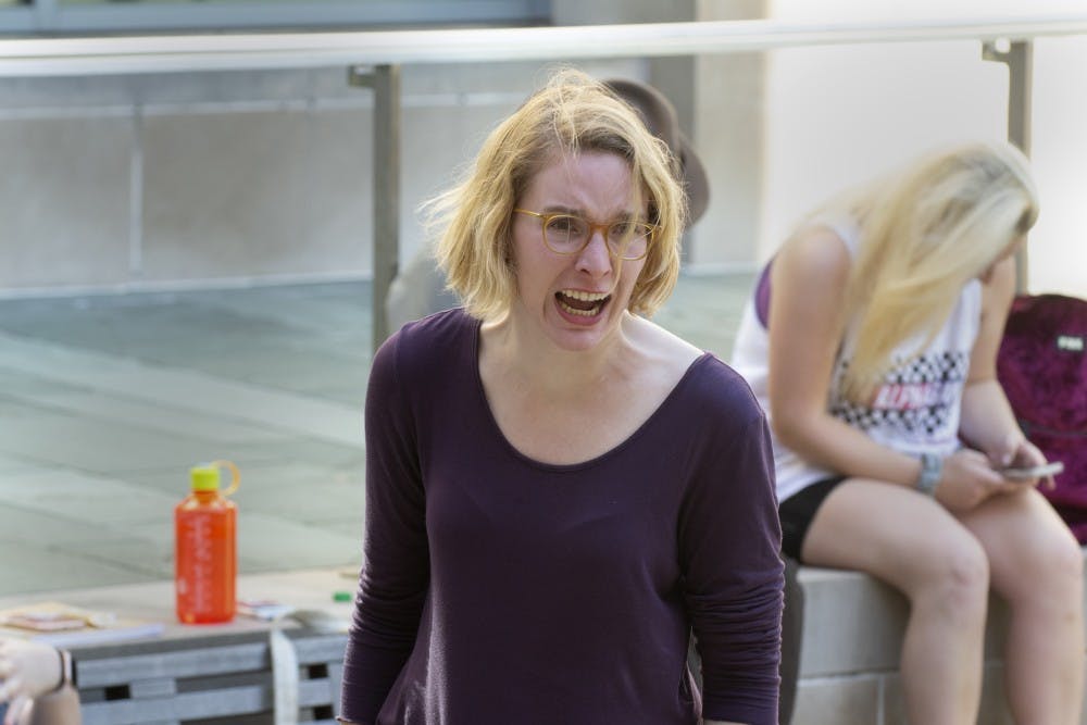 <p>Glynnis Kunkel-Ruiz rehearses April 22 for “Antigone” outside the Neal-Marshall Black Culture Center. Kunkel-Ruiz will play the titular role of Antigone in the play April 29 at the Conrad Prebys Ampitheater.</p>