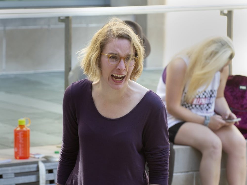 Glynnis Kunkel-Ruiz rehearses April 22 for “Antigone” outside the Neal-Marshall Black Culture Center. Kunkel-Ruiz will play the titular role of Antigone in the play April 29 at the Conrad Prebys Ampitheater.