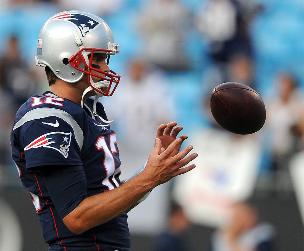 New England Patriots quarterback Tom Brady during a warmups prior to preseason action against the Carolina Panthers on Aug. 28 at Bank of America Stadium in Charlotte, N.C. Four games into the NFL season, Brady leads in passing yards and tied for second in touchdowns.