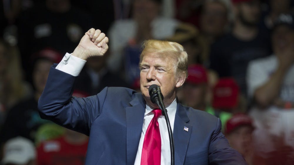 President Donald Trump holds up his fist during a rally May 10, at Northside Middle School in Elkhart, Indiana. President Trump will speak at a campaign event in Evansville, Indiana later this week, where he’s expected to urge supporters to vote for U.S. Senate candidate Mike Braun.