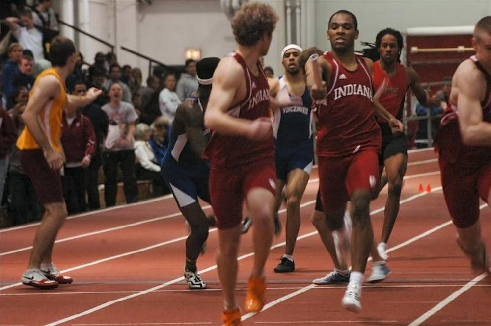 The Hoosier Relay team passes the baton Saturday afternoon at the Gladstein Fieldhouse. IU won thirteen events during the Indiana Relays held on Friday and Saturday.