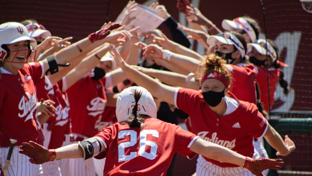 Senior infielder Grayson Radcliffe celebrates with her teammates after hitting a home run against Michigan State on Saturday at Andy Kaufman Field. The IU softball team went 2-1 this weekend against Michigan State at home. 