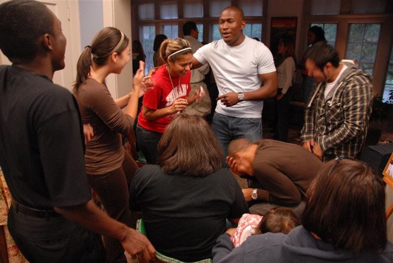 IU students have a laugh as they plan a skit during a call out meeting at La Casa Saturday evening. The event served to inform students on how to get involved in Latino related organizations on campus and and as a time to socialize.