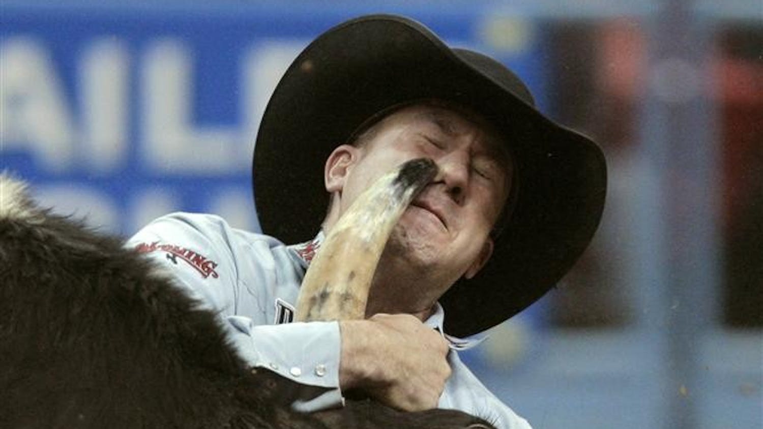 Les Shepperson, of Midwest, Wyo., competes during the first go-round of steer wrestling at the National Finals Rodeo at the Thomas & Mack Center Thursday in Las Vegas.