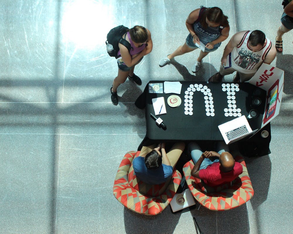 Students speak with representatives from IUSTV at the Media Involvement Fair in Franklin Hall Thursday afternoon.