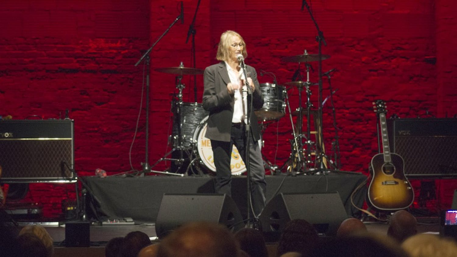 Laura Baird, John Lennon's sister, talks about her experience with the original Beatles band before the Mersey Beatles take the stage Friday night. The Buskirk-Chumley Theater was packed for the tribute band's third performance in Bloomington.