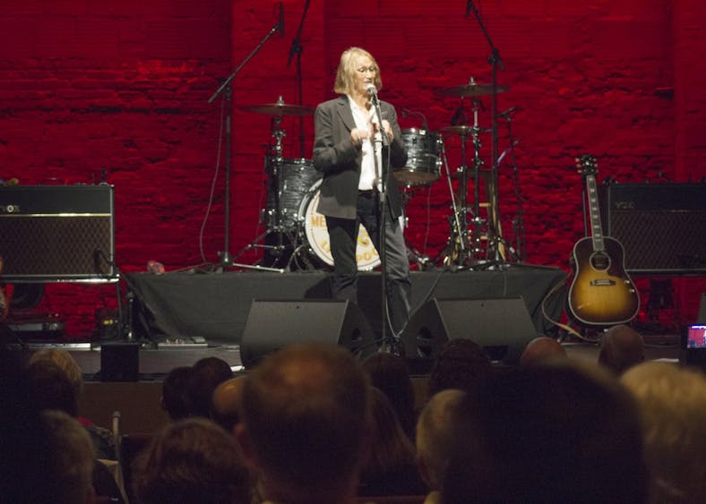 Laura Baird, John Lennon's sister, talks about her experience with the original Beatles band before the Mersey Beatles take the stage Friday night. The Buskirk-Chumley Theater was packed for the tribute band's third performance in Bloomington.