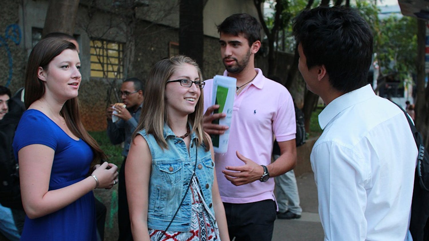 Jules Daugherty, an IU student studying abroad in Brazil, talks with Lucas Saito Valeriano on Wednesday night at their university in São Paulo. Daugherty says she has struggled with handling the degree of sexism even within platonic friendships here in Brazil.