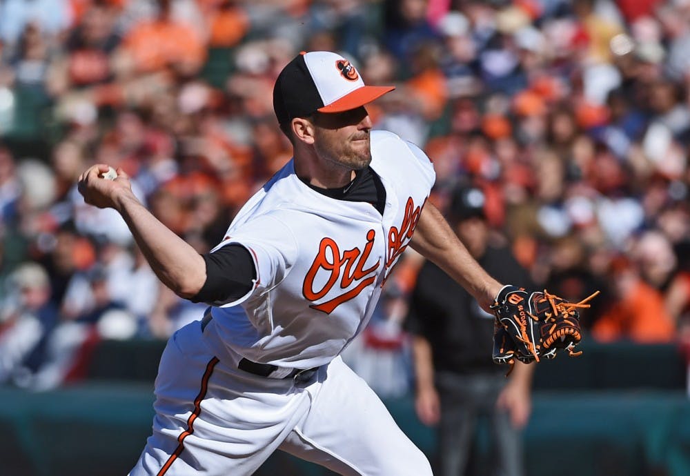<p>Baltimore Orioles pitcher Darren O'Day pitches in the ninth inning against the New York Yankees on April 9, 2017, at Oriole Park at Camden Yards in Baltimore.&nbsp;</p>