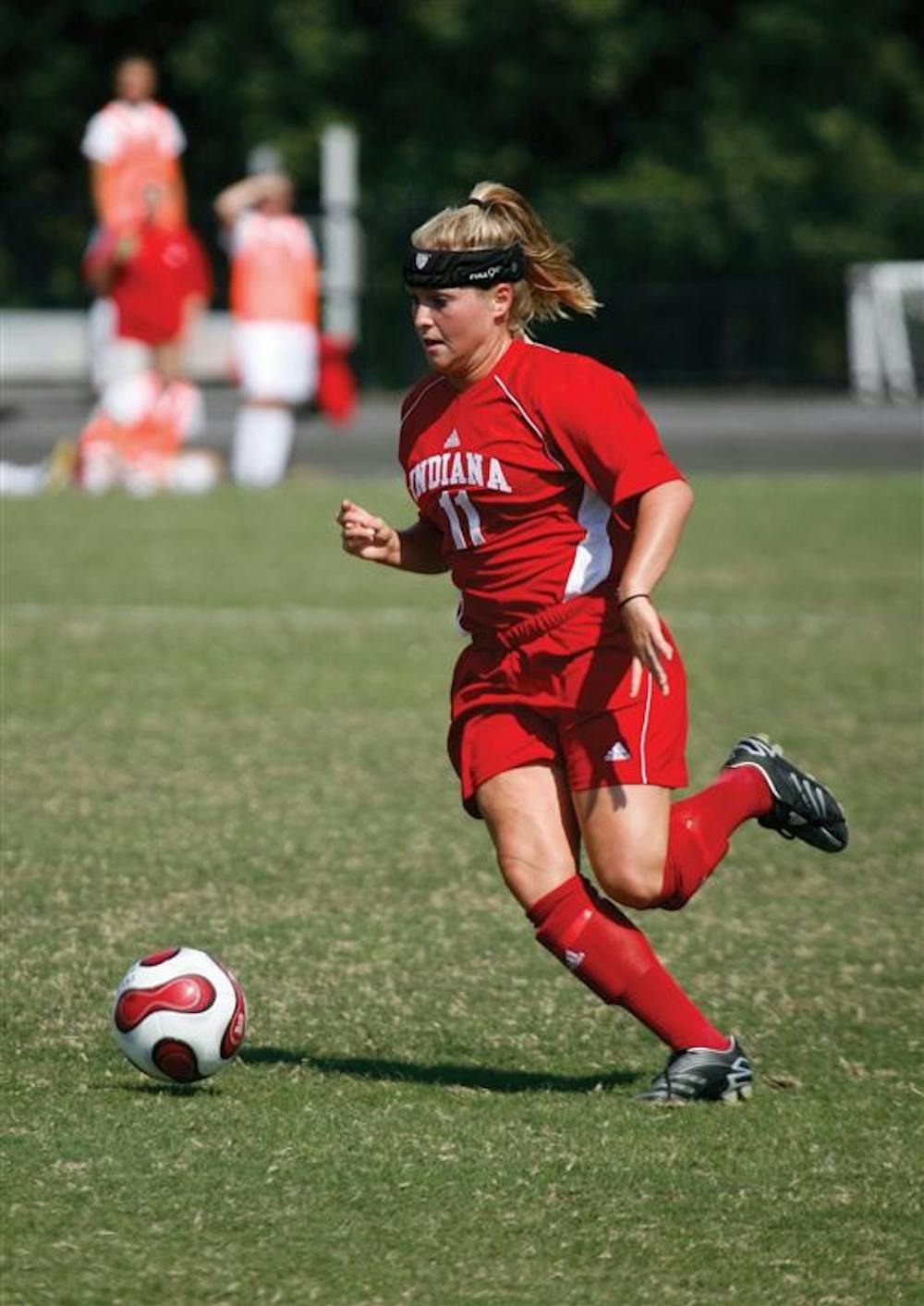 Junior forward Kristin Arnold plays the ball.