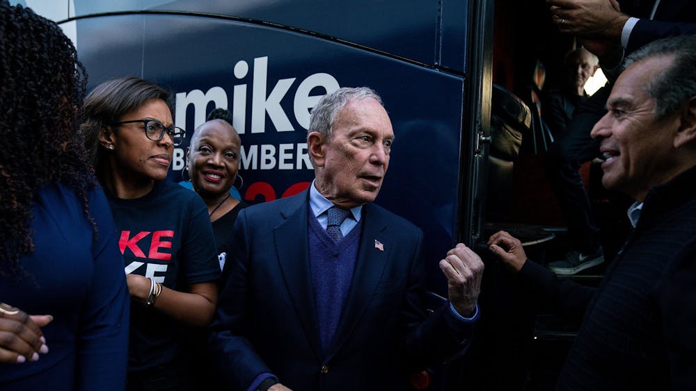 Democratic presidential candidate Michael Bloomberg speaks with former Los Angeles Mayor Antonio Villariagosa Feb. 3 after a campaign rally in Compton, California. 
