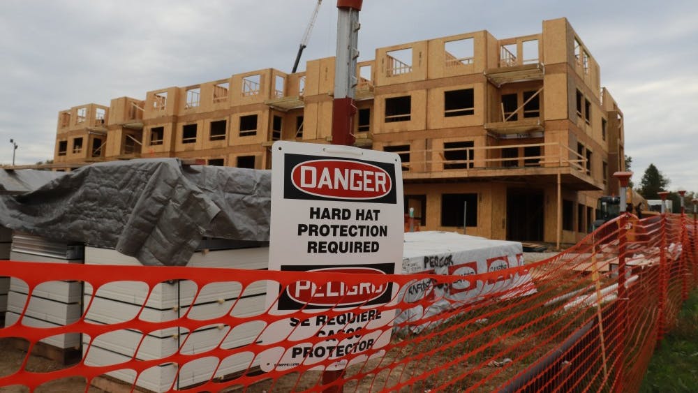 Warning signs are on display Oct. 25 at the Mills construction. The construction project is part of a partnership between Bloomington and Columbus, Indiana, to bring money to both cities to support start-ups. The construction site is located at 642 N. Madison Ave.&nbsp;