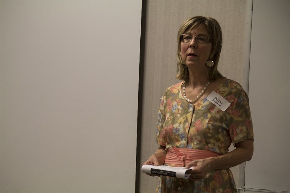 Kalynn Brewer, curator for the event, introduces one of the videos shown during the TEDxBloomington salon on Tuesday night in Monroe County Public Library. The event was titled "Once Upon a Time: The Power of a Well-Told Tale" and focused on the power of storytelling. 