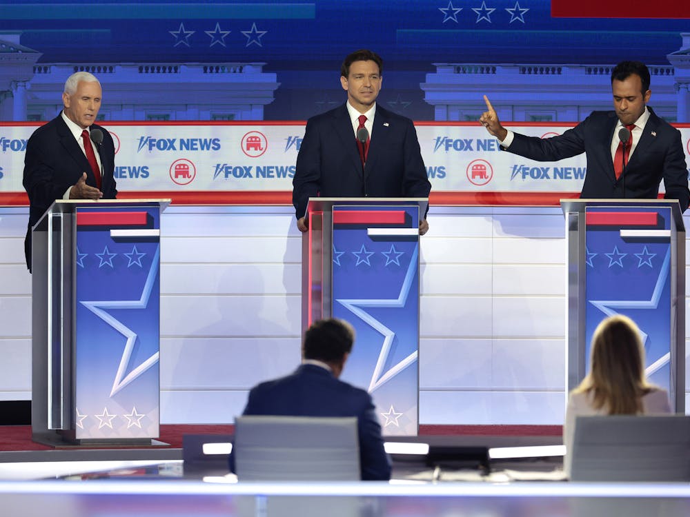 Republican presidential candidates, left to right, former U.S. Vice President Mike Pence, Florida Gov. Ron DeSantis and Vivek Ramaswamy participate in the first debate of the GOP primary season hosted by Fox News on Aug. 23, 2023, at the Fiserv Forum,in Milwaukee. 