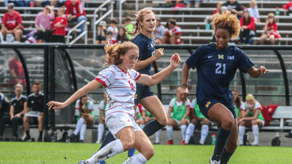 Junior midfielder Avery Lockwood goes to kick the ball Oct. 3, 2021, in Bill Armstrong Stadium against Michigan. Indiana women's soccer will play Penn State at 7 p.m. Wednesday.