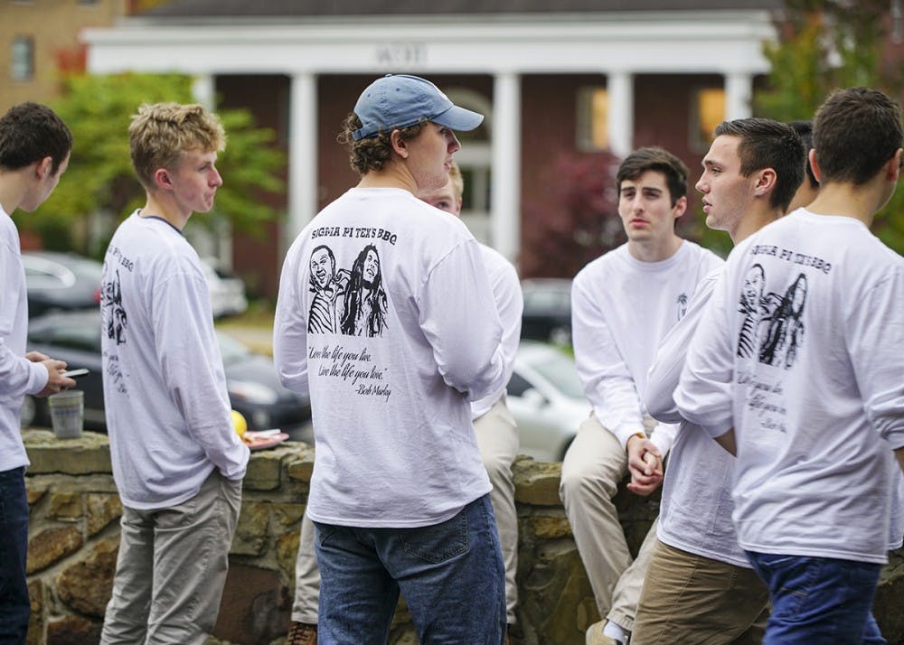 Sigma Pi brothers enjoy barbecue during the Sigma Pi Tex BBQ Sunday afternoon at the Sigma Pi fraternity house. The event raised money for IU Counseling and Psychological Services (CAPS) and the National Alliance on Mental Illness after Sigma Pi brother Nic “Tex” Smith killed himself earlier this year.