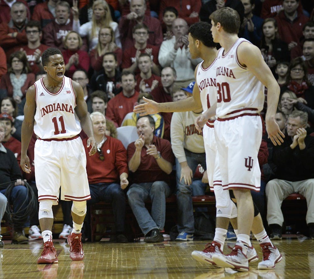 Junior guard Kevin "Yogi" Ferrell celebrates with teammates during IU's game against Ohio State on Saturday at Assembly Hall.