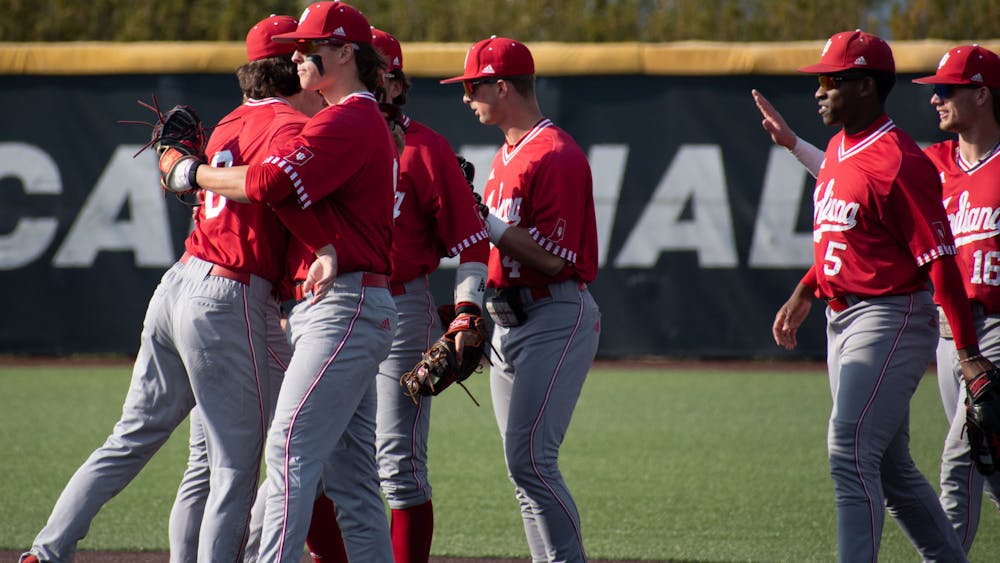 Players celebrate April 25, 2023 after winning 9-8 against Ball State University at First Merchant Ball Park Complex in Muncie, Indiana. Indiana baseball was selected to the NCAA Tournament Monday afternoon. 