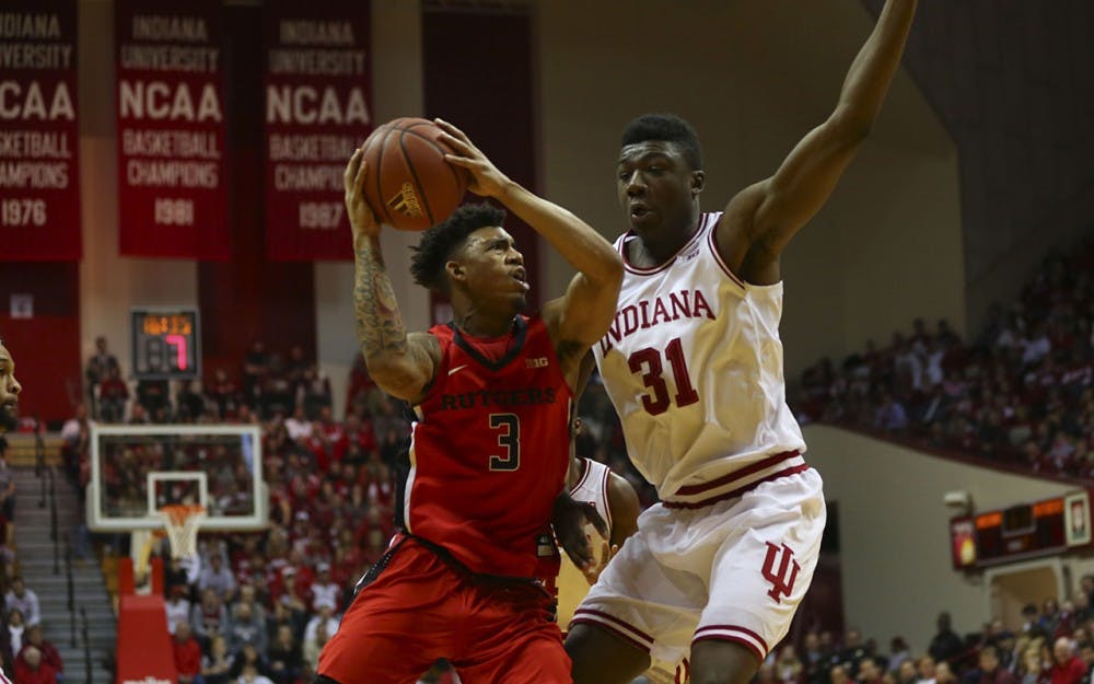Sophomore center Thomas Bryant denies access to sophomore guard Corey Sanders of Rutger's University.  The Hoosiers beat Scarlet Knights 76-57 Sunday. 