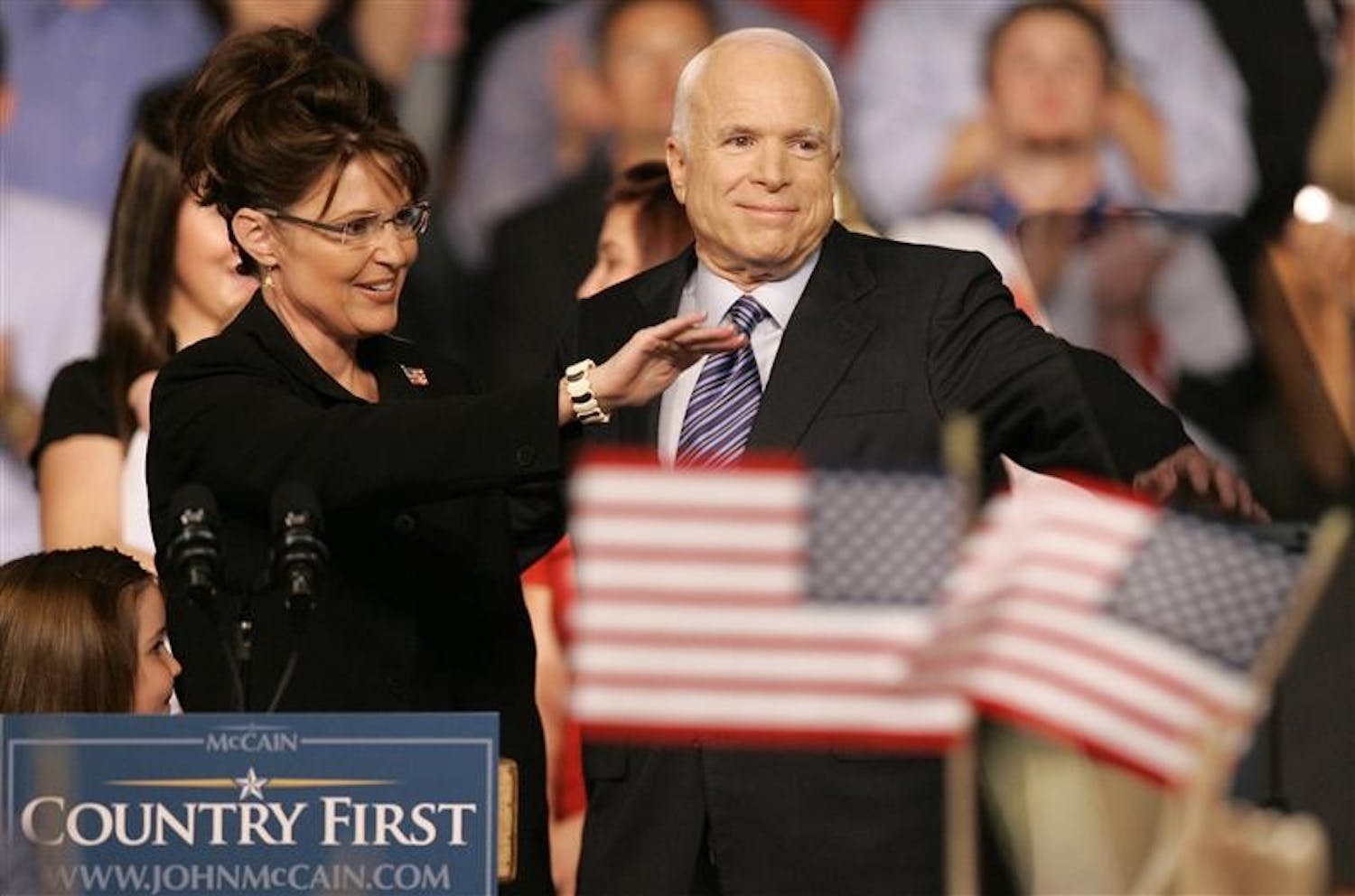 Republican presidential candidate, Sen. John McCain, R-Ariz., right, and Republican Alaska Gov. Sarah Palin wave as McCain introduces Palin as his Vice Presidential running mate Friday at Ervin J. Nutter Center in Dayton, Ohio. 