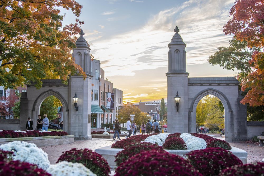 The sun sets Oct. 10, 2020, behind the Sample Gates. The IU student trustee application is now open to IU undergraduates and graduate students.