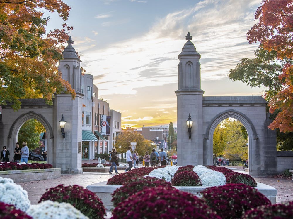The sun sets Oct. 10, 2020, behind the Sample Gates. The IU student trustee application is now open to IU undergraduates and graduate students.