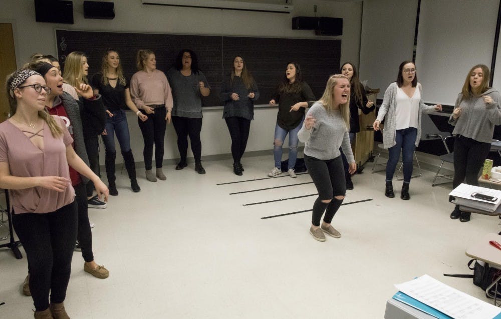 <p>Senior Hannah Naddy belts during Ladies First's rehearsal of "I Wanna Dance With Somebody" by Whitney Houston. Ladies First, one of IU's a cappella groups, rehearsed Monday, March 5, in the Simon Music Center.&nbsp;</p>