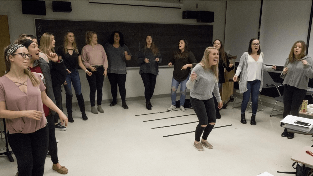 Senior Hannah Naddy belts during Ladies First's rehearsal of "I Wanna Dance With Somebody" by Whitney Houston. Ladies First, one of IU's a cappella groups, rehearsed Monday, March 5, in the Simon Music Center.&nbsp;