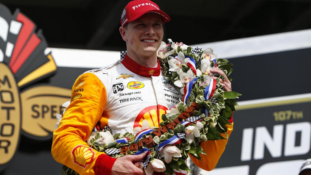 Team Penske's Josef Newgarden wears the Indianapolis 500 winner's wreath at Indianapolis Motor Speedway Sunday, May 28. 