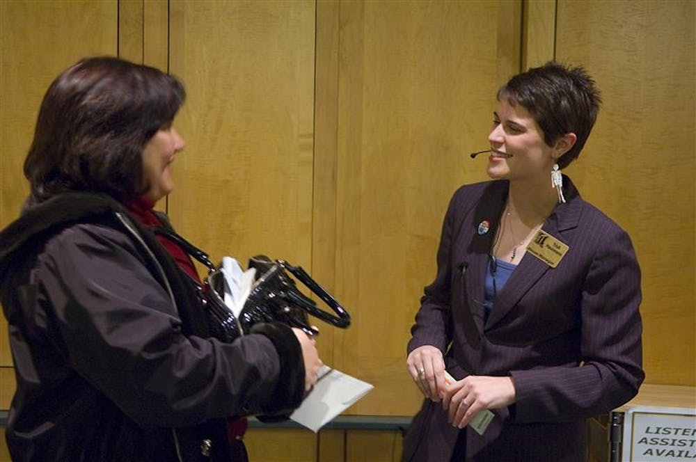 House manager Trish Hausmann (right) talks with an audience member before a performance of "The Wild Party" Friday night at the Lee Norvelle Theatre and Drama Center.