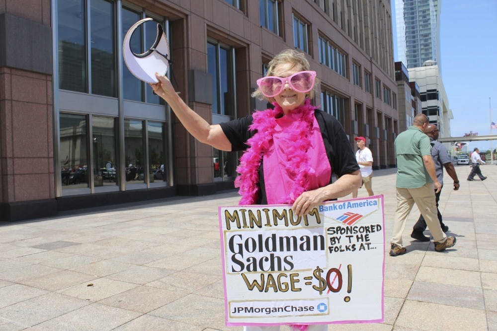 Ann Wright, 70, is protesting with Code Pink: Women for Peace and Veterans for Peace in Cleveland. Wright, however, says she is with "Billionaires for Trump," and aims to send a satirical message referencing big banks and corporate America's role in political campaigns.