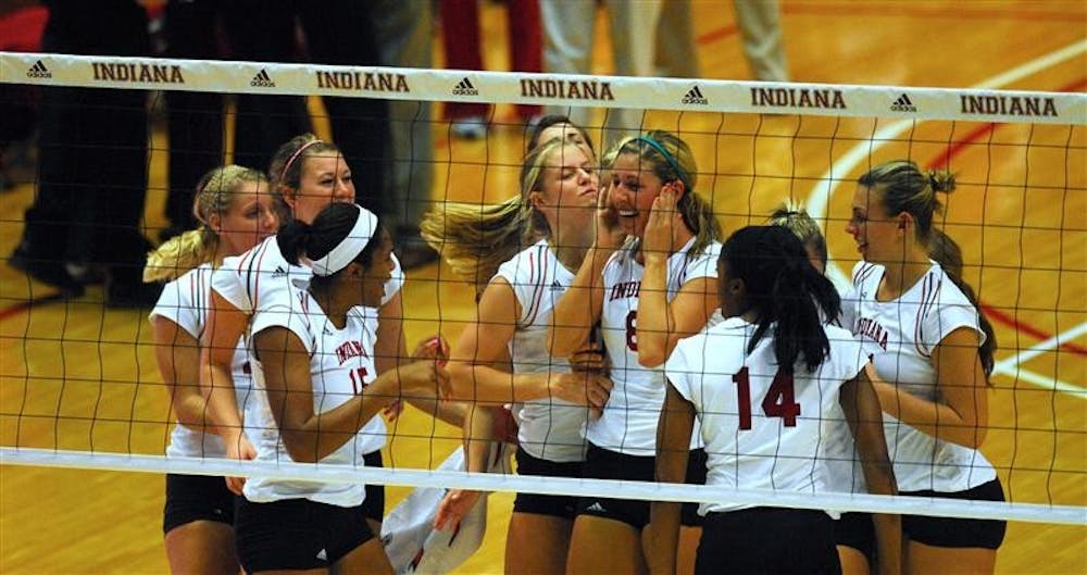 The IU women's volleyball team celebrate their victory over Ohio State on Friday, Oct. 17 at Assembly Hall.