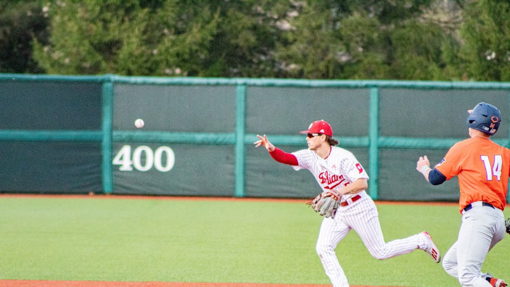 Then-freshman infielder Paul Toetz flips the ball over to second base April 10, 2021. Indiana will play Purdue in West Lafayette Saturday through Monday.